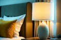 modern bright bedside lamp in hotel apartments