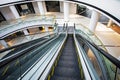 Modern bright interior in a shopping center with an escalator. view from above Royalty Free Stock Photo