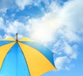 Bright umbrella against blue sky. Sun protection Royalty Free Stock Photo