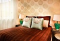 Modern brown color bed with pillows closeup in a luxury hotel or