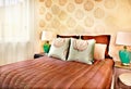 Modern brown color bed with pillows closeup in a luxury hotel or house