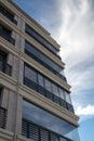 Modern building against the blue cloudy sky close-up Royalty Free Stock Photo