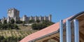 Modern building against old spanish castle Royalty Free Stock Photo