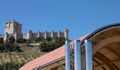 Modern building against old spanish castle Royalty Free Stock Photo