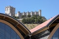 Modern building against old spanish castle Royalty Free Stock Photo