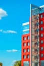 Modern building on a background of blue sky with clouds Royalty Free Stock Photo