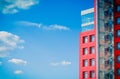 Modern building on a background of blue sky with clouds Royalty Free Stock Photo