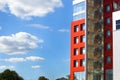 Modern building on a background of blue sky with clouds Royalty Free Stock Photo