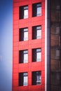 Modern building on a background of blue sky with clouds Royalty Free Stock Photo