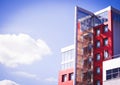 modern building on a background of blue sky with clouds Royalty Free Stock Photo