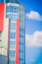 modern building on a background of blue sky with clouds Royalty Free Stock Photo