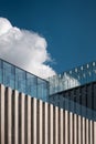 modern building on blue sky background, contemporary artistic architecture of concrete and glass, sharp triangle shapes Royalty Free Stock Photo