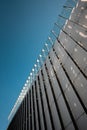 modern building on blue sky background, contemporary artistic architecture of concrete and glass, sharp triangle shapes Royalty Free Stock Photo