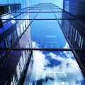 Modern building with blue sky and cloud reflections Royalty Free Stock Photo
