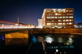 Modern building and bridge over Codorus Creek at night, in York, Pennsylvania. Royalty Free Stock Photo