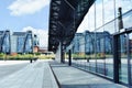 Modern building of EC1 and its reflection in glass wall of railway station Lodz Fabryczna