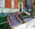 Modern building entrance with ramp for wheelchair Royalty Free Stock Photo