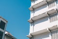 Modern building exterior with concrete brick walls, grey doors exit stairs with Blue Sky Royalty Free Stock Photo