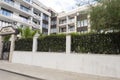 Modern Building Exterior. Facade of a Modern Apartment Building. Vacation Complex Hotel Building, With Stone Tiling Facade