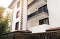 Modern Building Exterior. Facade of a Modern Apartment Building. Vacation Complex Hotel Building, With Stone Tiling Facade. Sun Fl