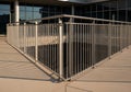 A modern building exterior featuring a metal railing alongside a Royalty Free Stock Photo