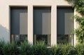 Modern building facade features closed grey roller blinds on large windows. Exterior architectural element provides shade privacy Royalty Free Stock Photo