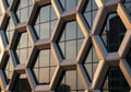 A modern building facade featuring a honeycomb pattern with hexagonal shapes Royalty Free Stock Photo