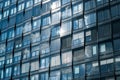 Modern building facade , office windows sky reflection Royalty Free Stock Photo