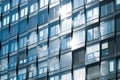 Modern building facade , office windows sky reflection Royalty Free Stock Photo