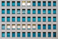 Modern building facade with window glass sky color reflected and some lighted from the inside Royalty Free Stock Photo