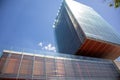 Modern Building Glass Facade Against Blue Sky. Company Office In City Center.