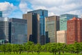 Modern building with green Zen garden on blue sky background in Royalty Free Stock Photo