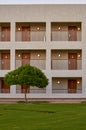 Modern building, hotel rooms at the evening with glowing lamps Royalty Free Stock Photo