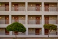 Modern building, hotel rooms at the evening with glowing lamps Royalty Free Stock Photo