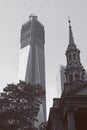 Modern building next to old church Royalty Free Stock Photo