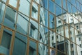 The modern building is reflected in the facade of another building Royalty Free Stock Photo