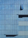 Modern building with reflections from the sky and only one opened window Royalty Free Stock Photo