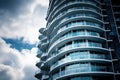 A modern building in rounded shapes against a dark sky. Generated by AI Royalty Free Stock Photo