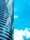 Modern building, skyscrapers reflection blue sky and clouds. Abstract technology background