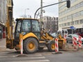 Modern building tractor parked on a street