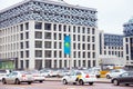 modern building, vertical Kazakhstan flag, highway, cars a lot. traffic, taxi. Astana Nur-Sultan, Kazakhstan