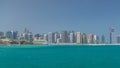 Modern buildings in Abu Dhabi skyline timelapse with mall and beach. Royalty Free Stock Photo