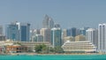 Modern buildings in Abu Dhabi skyline timelapse with mall and beach. Royalty Free Stock Photo