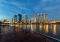 Buildings and business district cityscape from urban park,night view,cityscape image of Benchakitti Park,Bangkok,Thailand