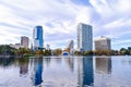 Modern buildings , colorful amphitheater and autumn forest at Lake Eola Park in Orlando Downtown area.