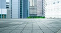 Modern buildings with empty concrete square floor