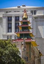 Modern buildings and historic Chinese Pagoda Tower in Chinatown near Downtown, San Francisco, California on a sunny day