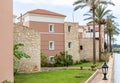 Modern buildings on the island of Crete, Greece. Hotel area and palm trees. Luxury tropical apartment resort complex.