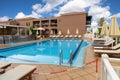 Modern buildings on the island of Crete, Greece. Hotel area with swimming pool. Luxury tropical apartment resort complex Royalty Free Stock Photo