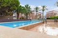 Modern buildings on the island of Crete, Greece. Hotel area with swimming pool. Luxury tropical apartment resort complex Royalty Free Stock Photo